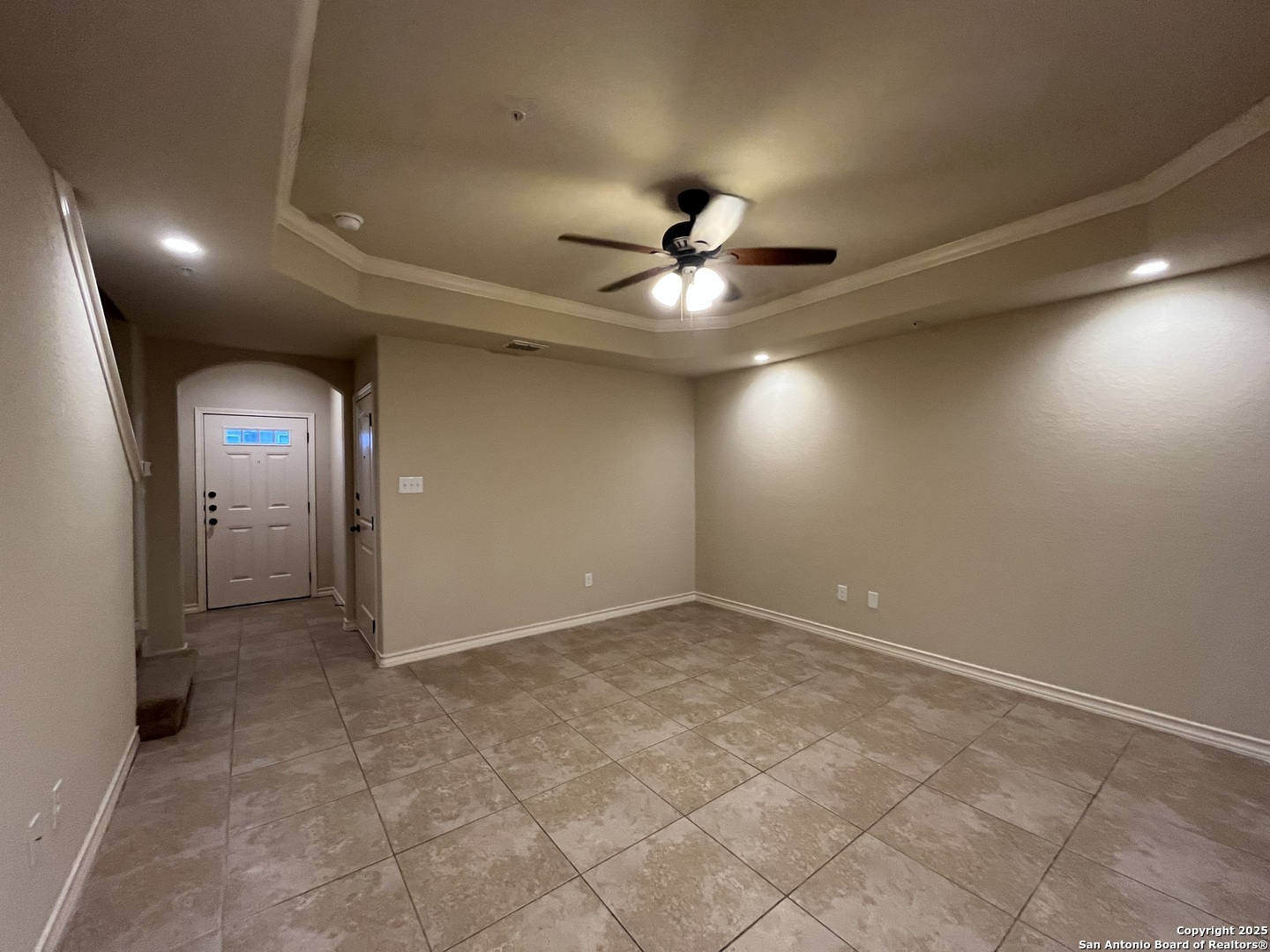 6514 Marcel Way, Unit 103 San Antonio, TX 78233 - Photo 6 of 28 an empty room with fan and entrance