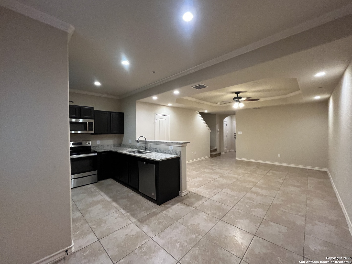 6514 Marcel Way, Unit 103 San Antonio, TX 78233 - Photo 8 of 28 a large room with a large window and kitchen view