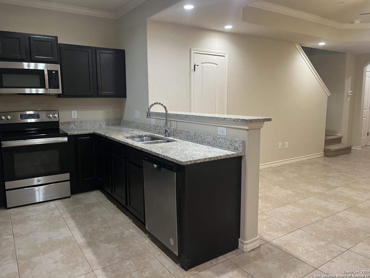 6514 Marcel Way, Unit 103 San Antonio, TX 78233 - Photo 10 of 28 a kitchen with a sink and a stove top oven
