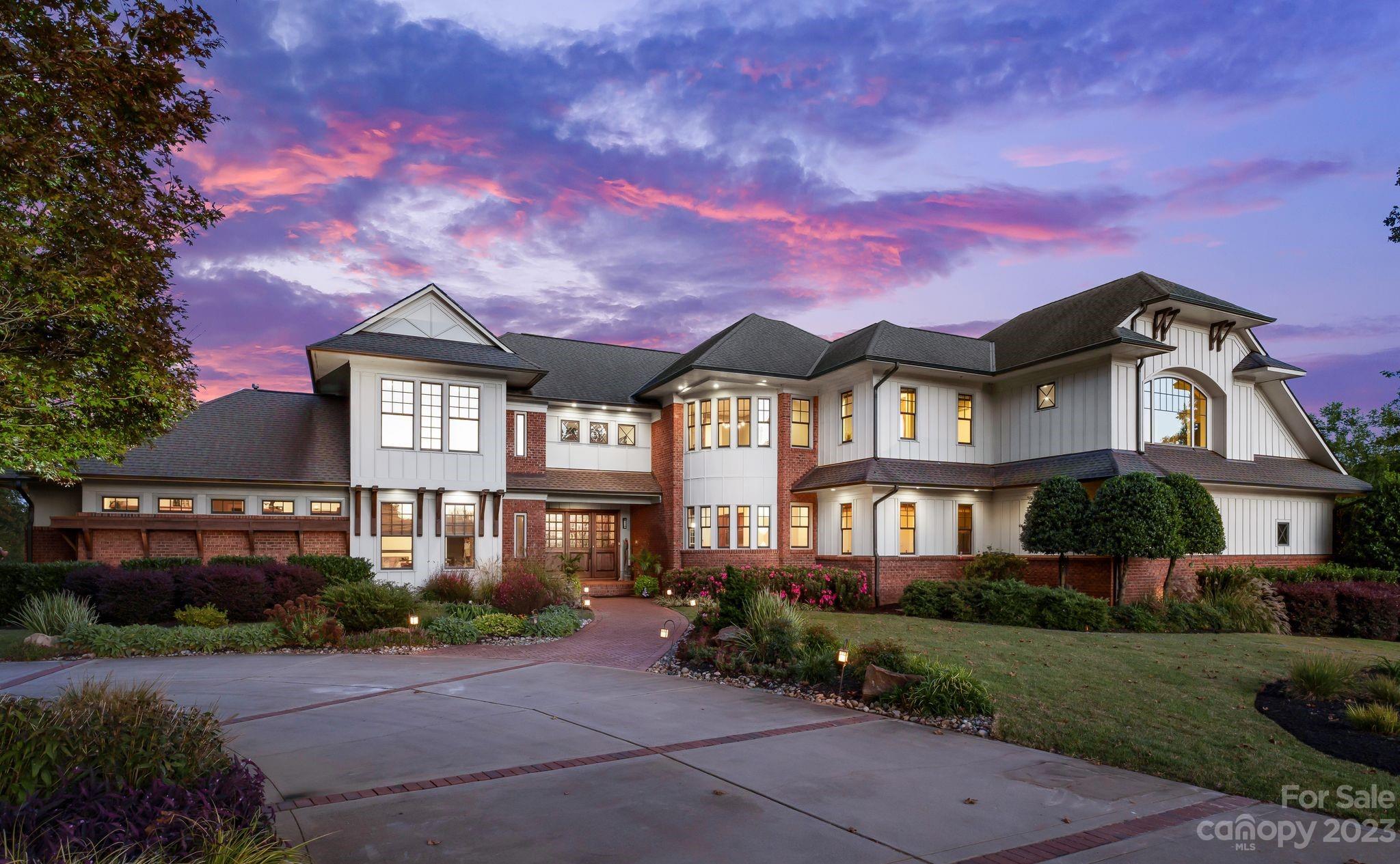 a front view of a residential houses with yard