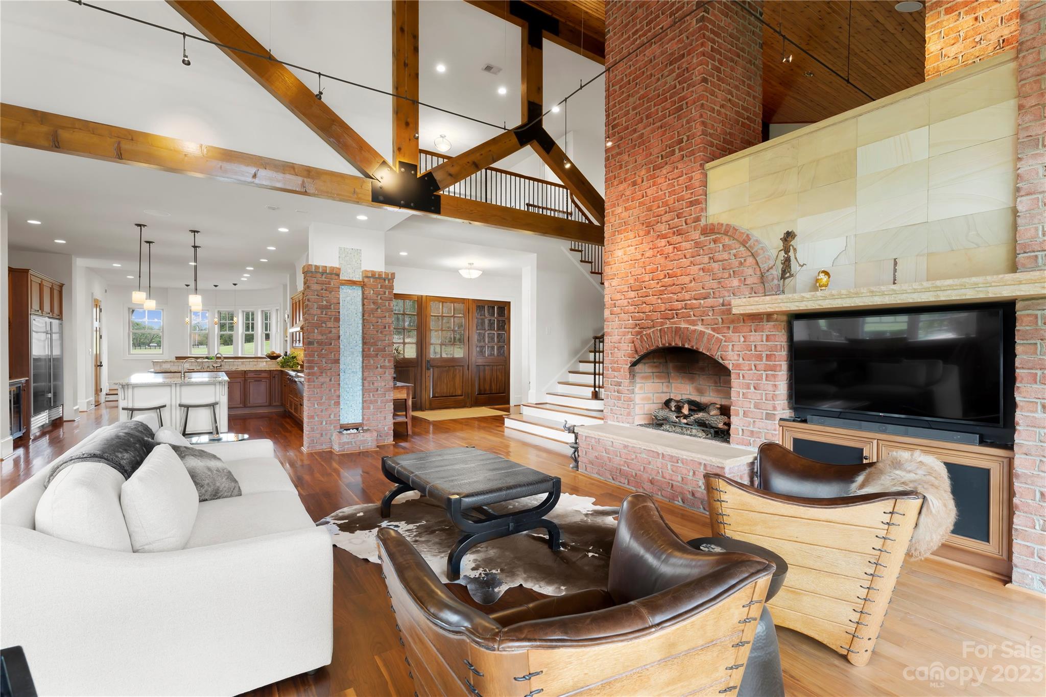13500 Cabarrus Station Road Midland, NC 28107 - Photo 17 of 48 a living room with furniture a flat screen tv and kitchen view