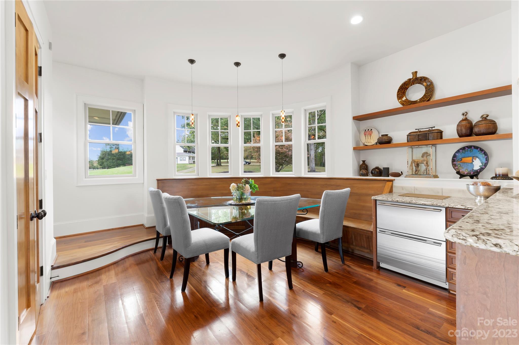 13500 Cabarrus Station Road Midland, NC 28107 - Photo 21 of 48 a dining room with furniture and wooden floor