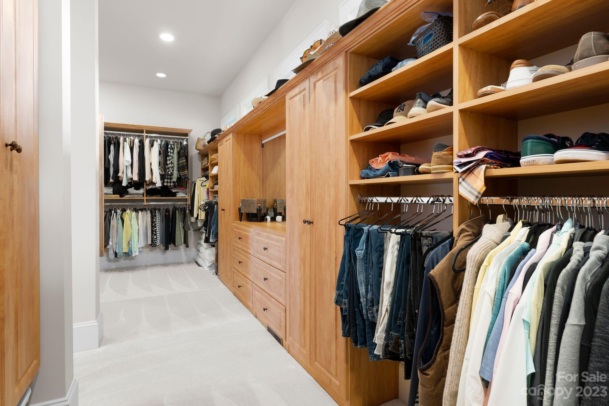 13500 Cabarrus Station Road Midland, NC 28107 - Photo 28 of 48 a view of walk in closet with clothes and shoes