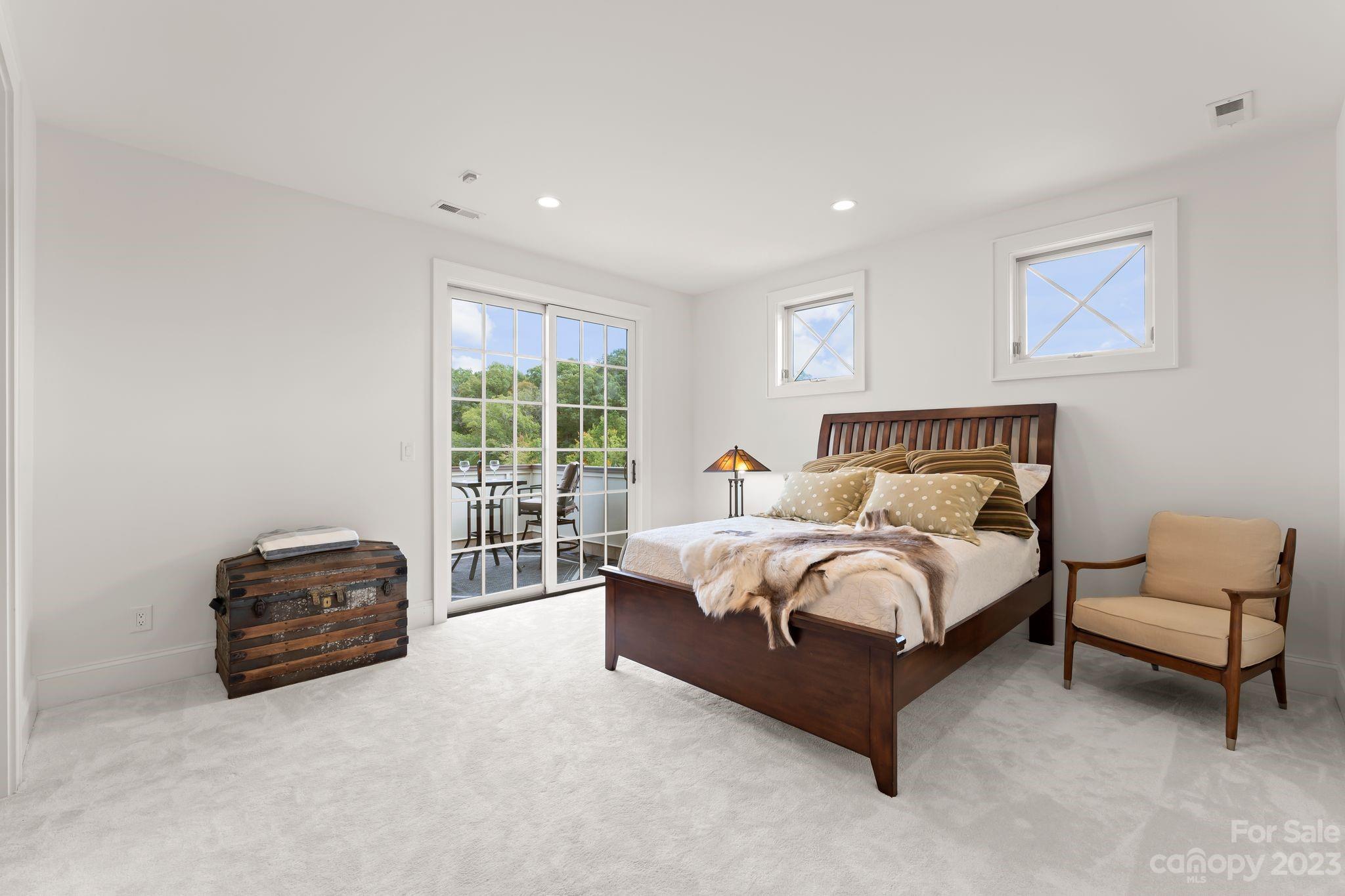 13500 Cabarrus Station Road Midland, NC 28107 - Photo 29 of 48 a spacious bedroom with a bed and a couch