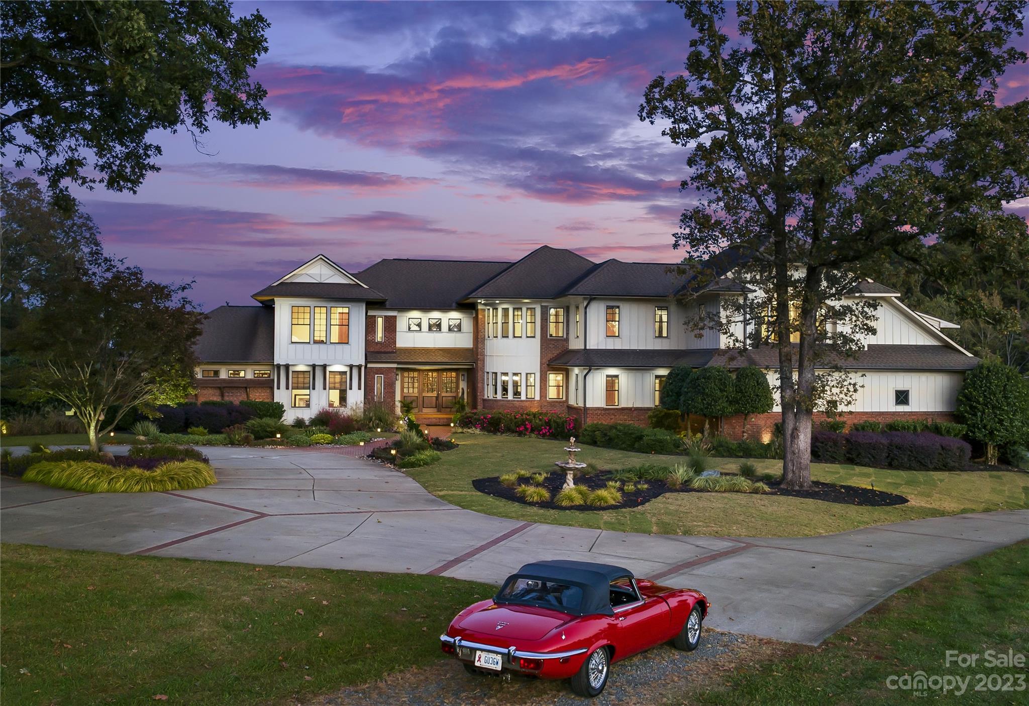 13500 Cabarrus Station Road Midland, NC 28107 - Photo 3 of 48 a front view of a house with a garden and trees