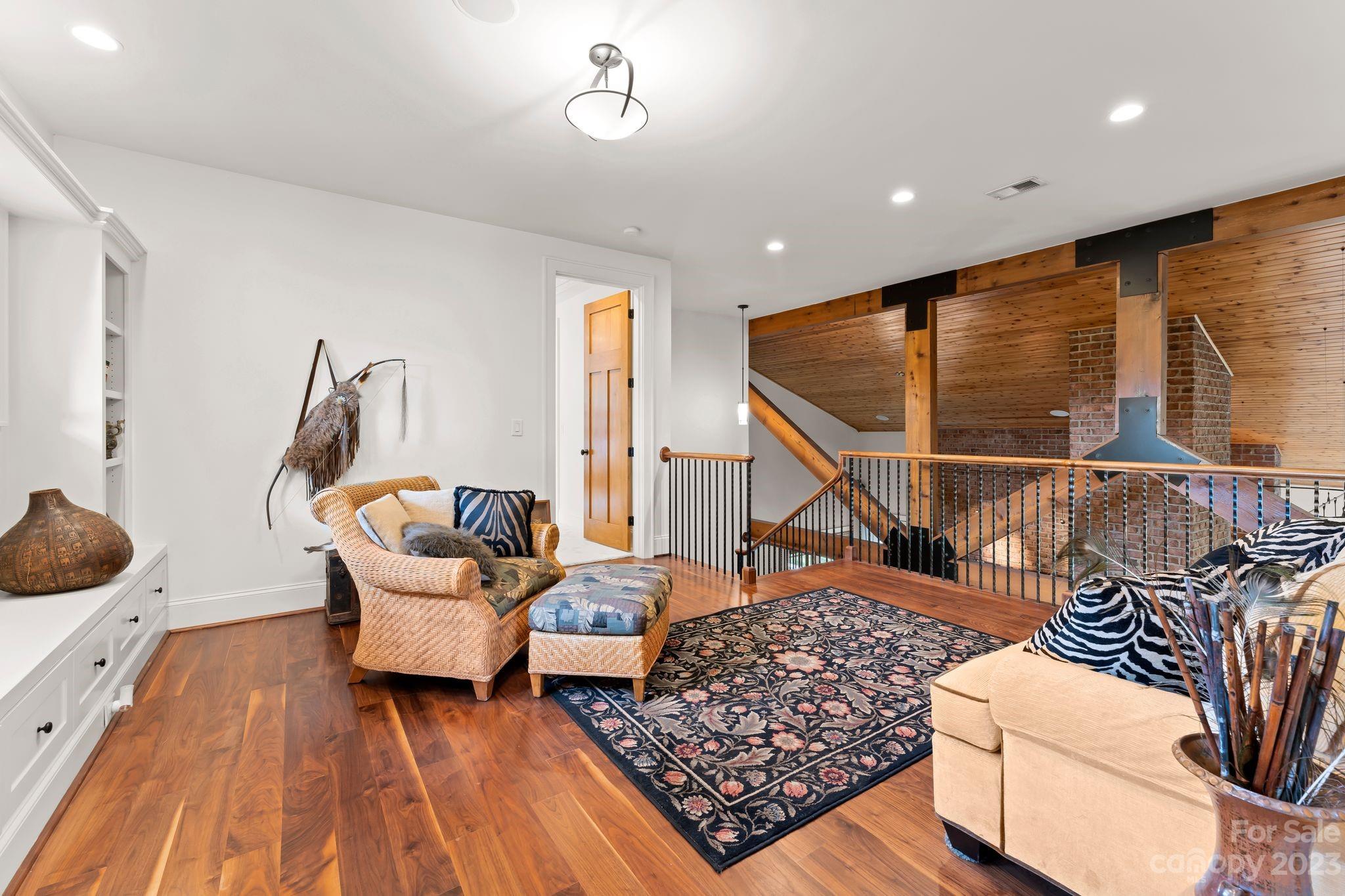 13500 Cabarrus Station Road Midland, NC 28107 - Photo 32 of 48 a living room with furniture and a wooden floor