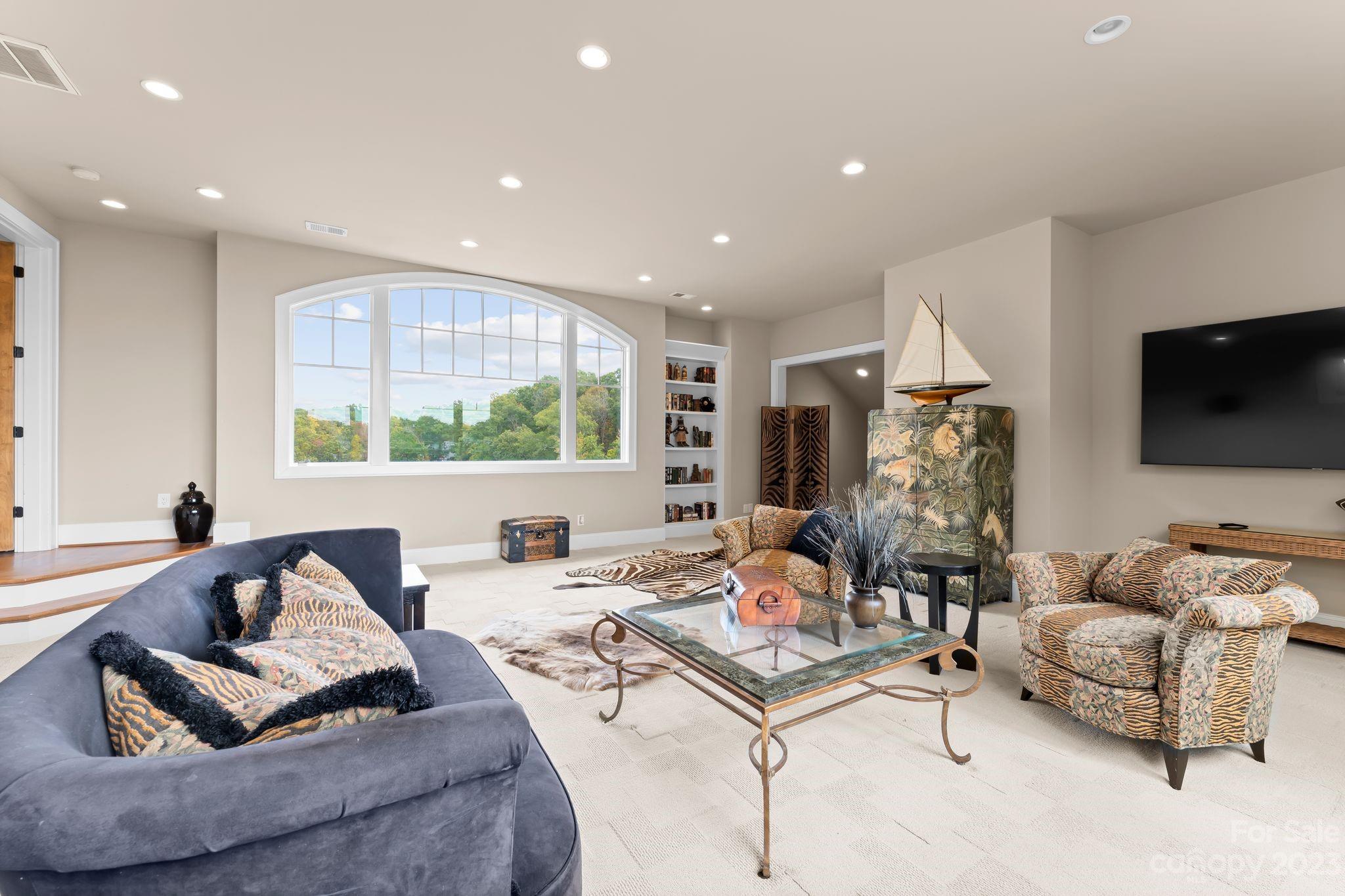 13500 Cabarrus Station Road Midland, NC 28107 - Photo 36 of 48 a living room with furniture and a flat screen tv