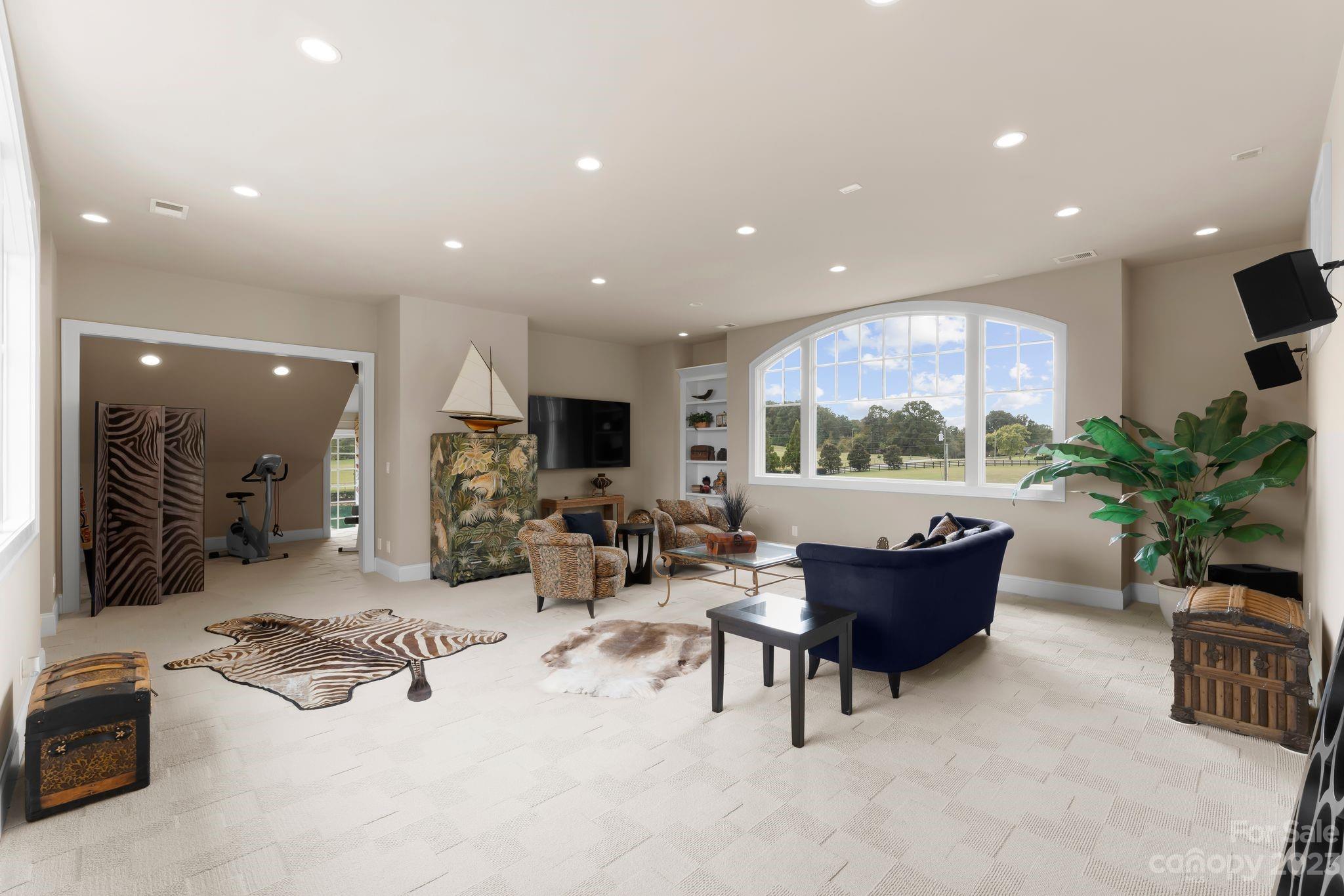 13500 Cabarrus Station Road Midland, NC 28107 - Photo 40 of 48 a living room with furniture and a potted plant