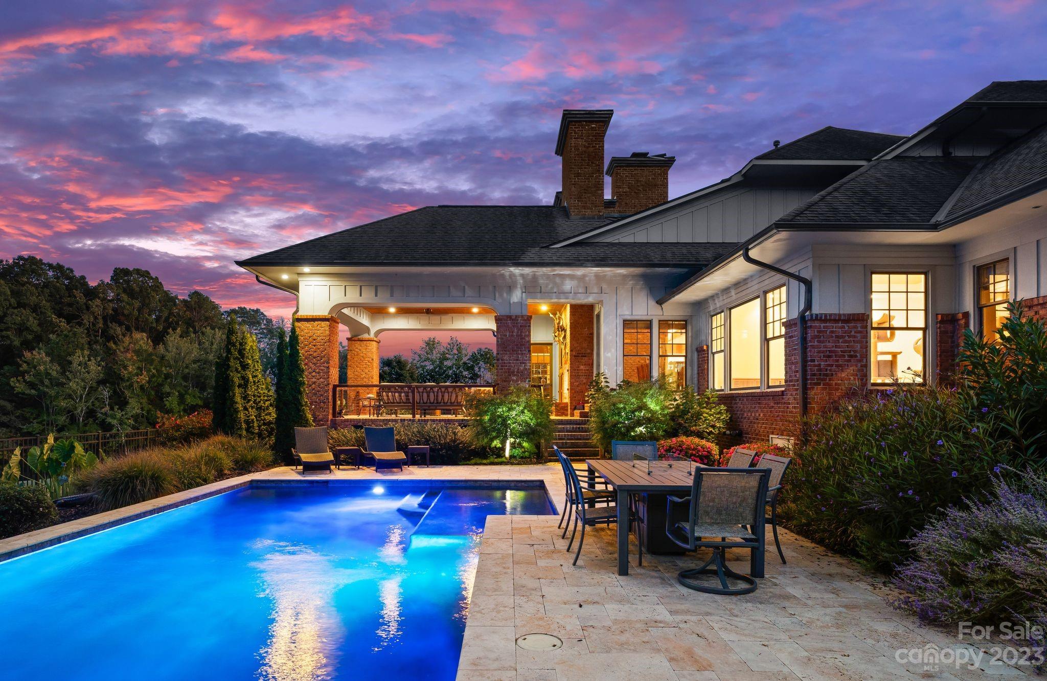 13500 Cabarrus Station Road Midland, NC 28107 - Photo 4 of 48 a view of a patio with a dining table and chairs with wooden floor and fence