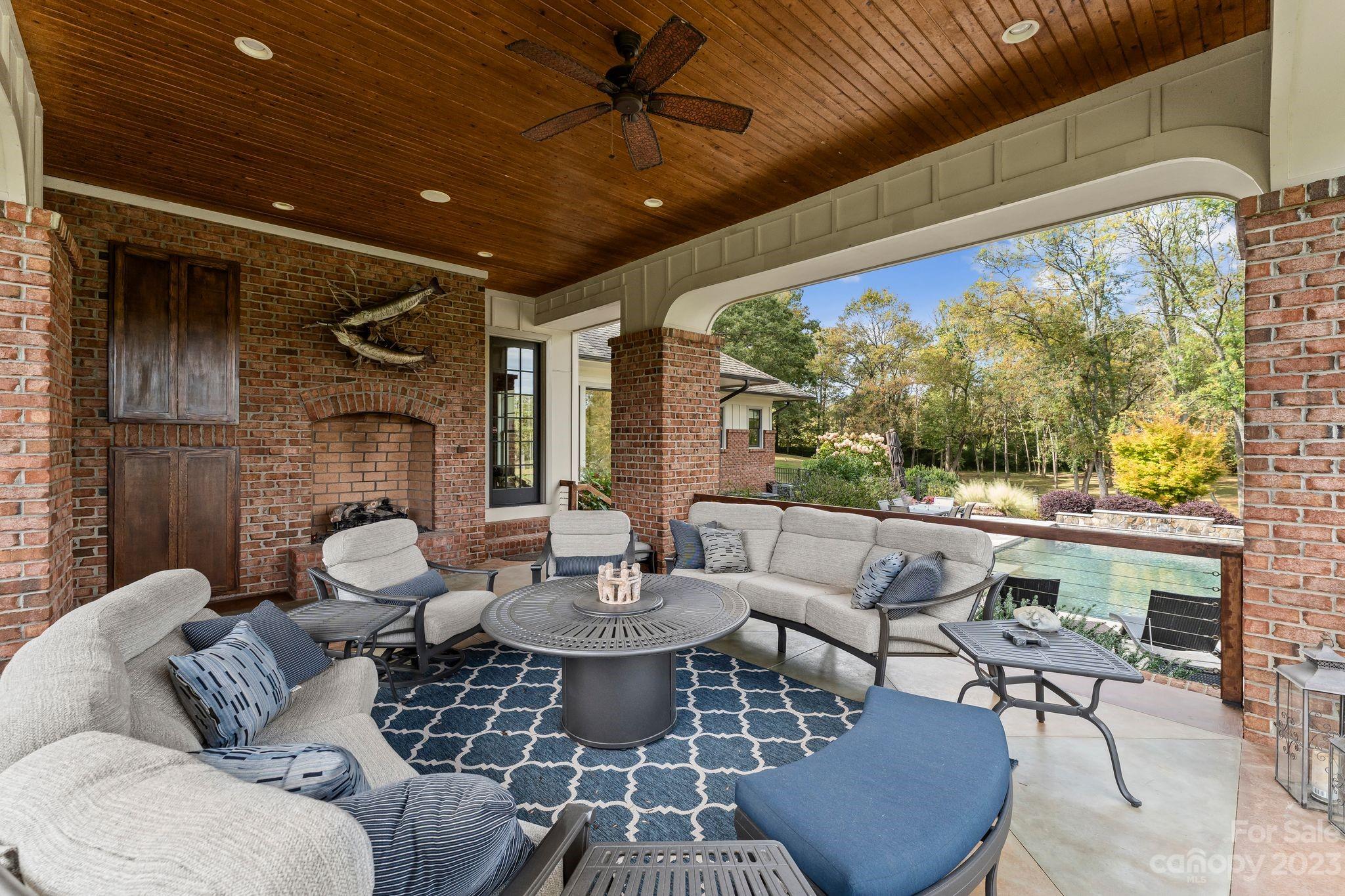 13500 Cabarrus Station Road Midland, NC 28107 - Photo 45 of 48 a living room with fireplace furniture and a large window