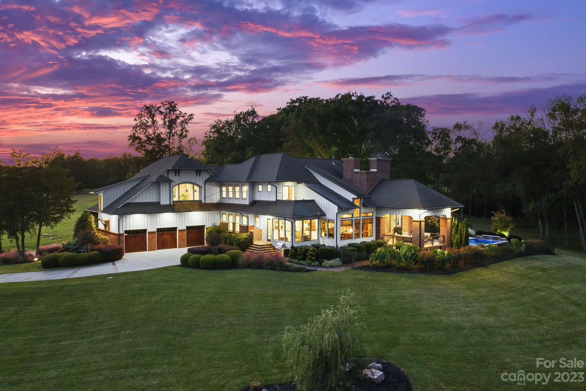 13500 Cabarrus Station Road Midland, NC 28107 - Photo 48 of 48 a front view of a house with a garden and trees