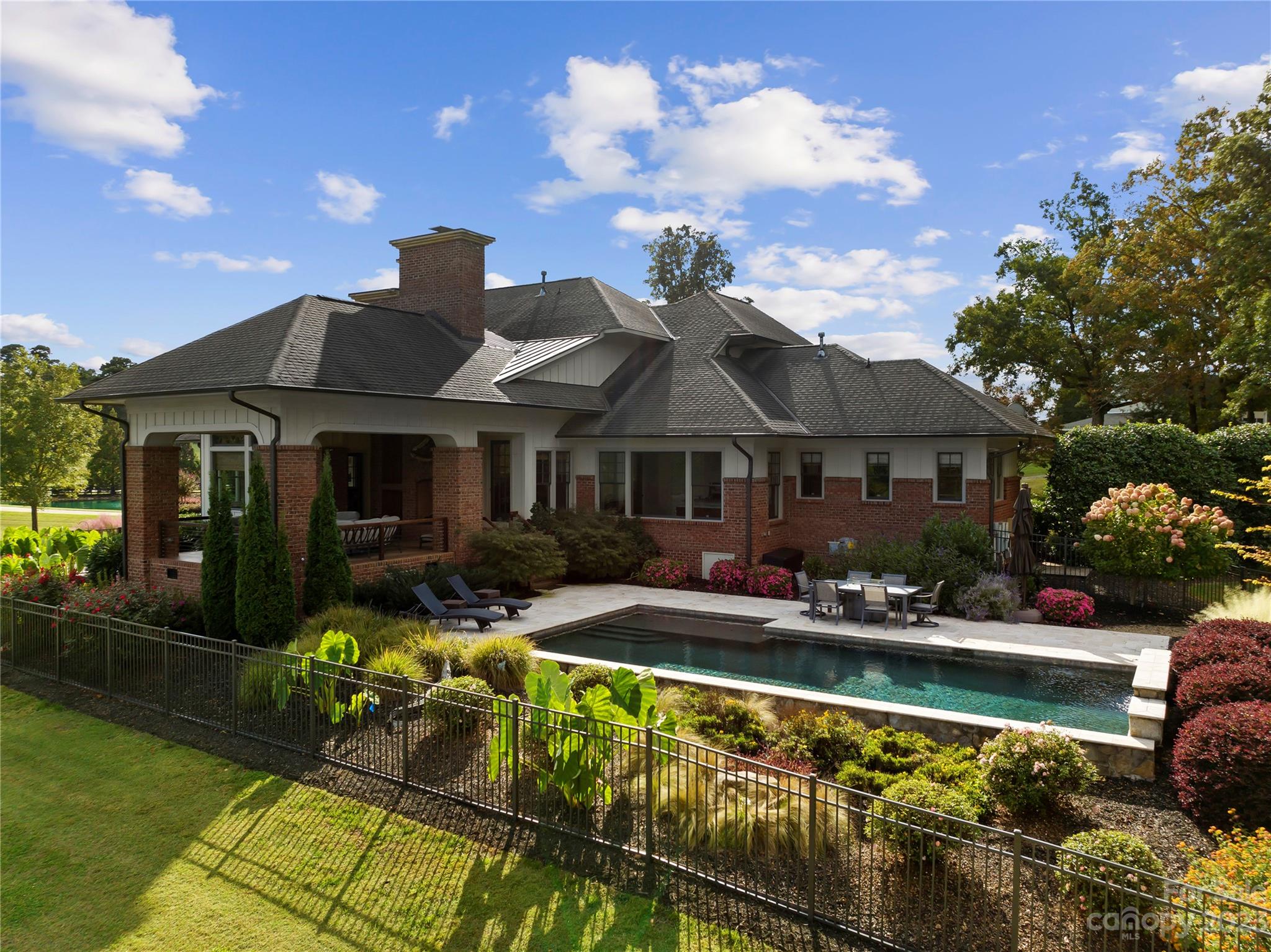 13500 Cabarrus Station Road Midland, NC 28107 - Photo 10 of 48 a front view of house with yard outdoor seating and barbeque oven