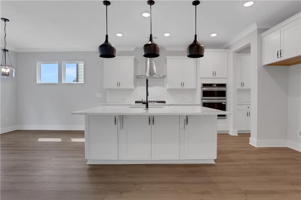 508 Pine Bough Road Ball Ground, GA 30107 - Photo 15 of 47 a view of an empty room with wooden floor