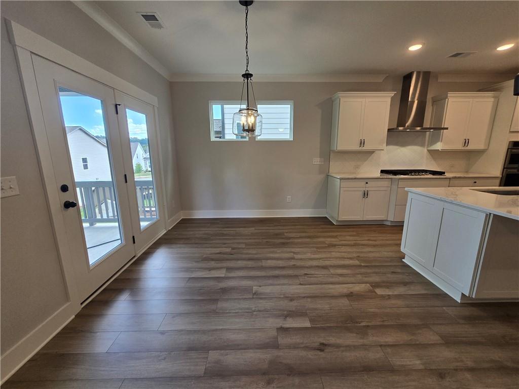 508 Pine Bough Road Ball Ground, GA 30107 - Photo 21 of 47 a kitchen with stainless steel appliances granite countertop a stove a sink and a refrigerator