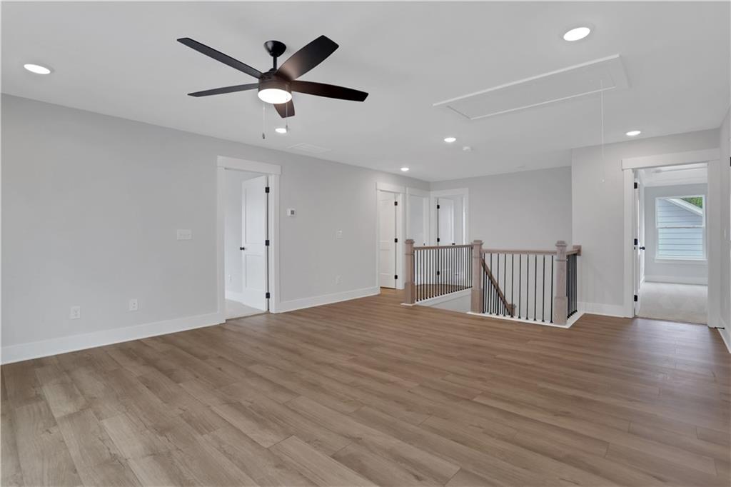 508 Pine Bough Road Ball Ground, GA 30107 - Photo 28 of 47 a view of an empty room with a ceiling fan