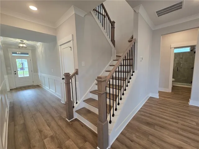 a view of entryway with wooden floor