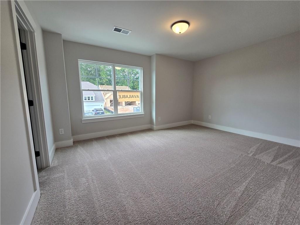 508 Pine Bough Road Ball Ground, GA 30107 - Photo 38 of 47 an empty room with a window
