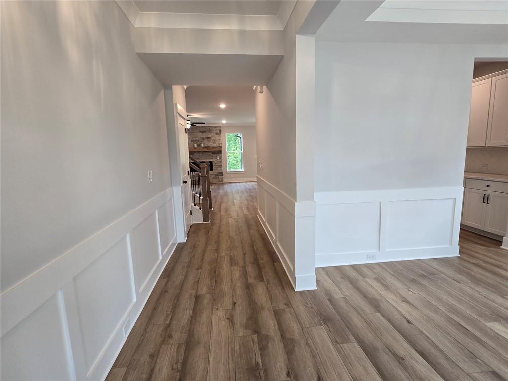 508 Pine Bough Road Ball Ground, GA 30107 - Photo 4 of 47 a view of a hallway with wooden floor