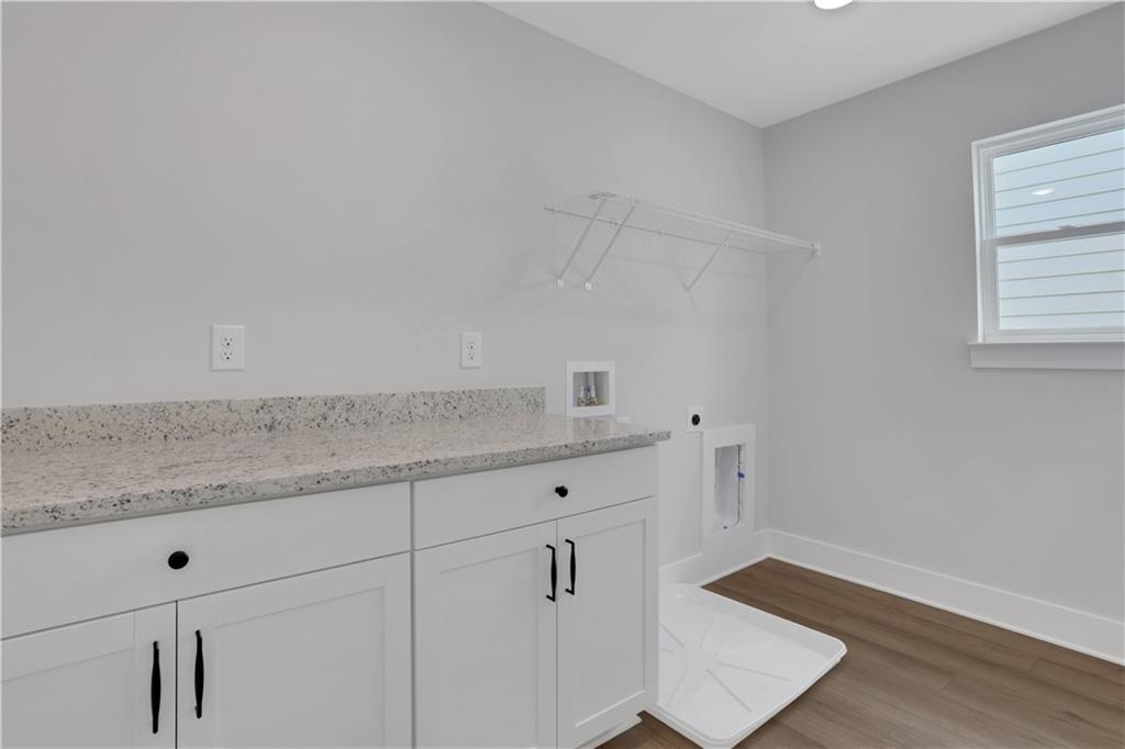 508 Pine Bough Road Ball Ground, GA 30107 - Photo 45 of 47 a room with white cabinets