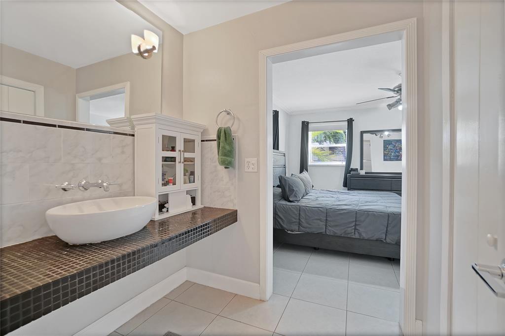 8101 Southwest 198th Street Cutler Bay, FL 33189 - Photo 12 of 16 a living room with furniture and a bathtub