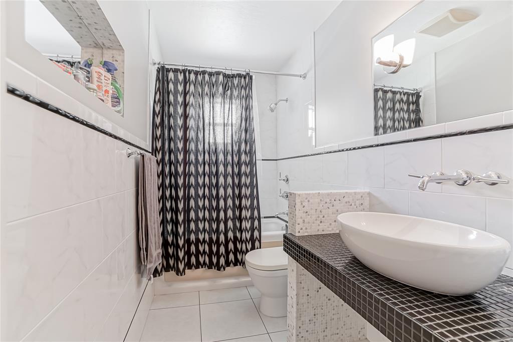 8101 Southwest 198th Street Cutler Bay, FL 33189 - Photo 6 of 16 a bathroom with a sink toilet and shower