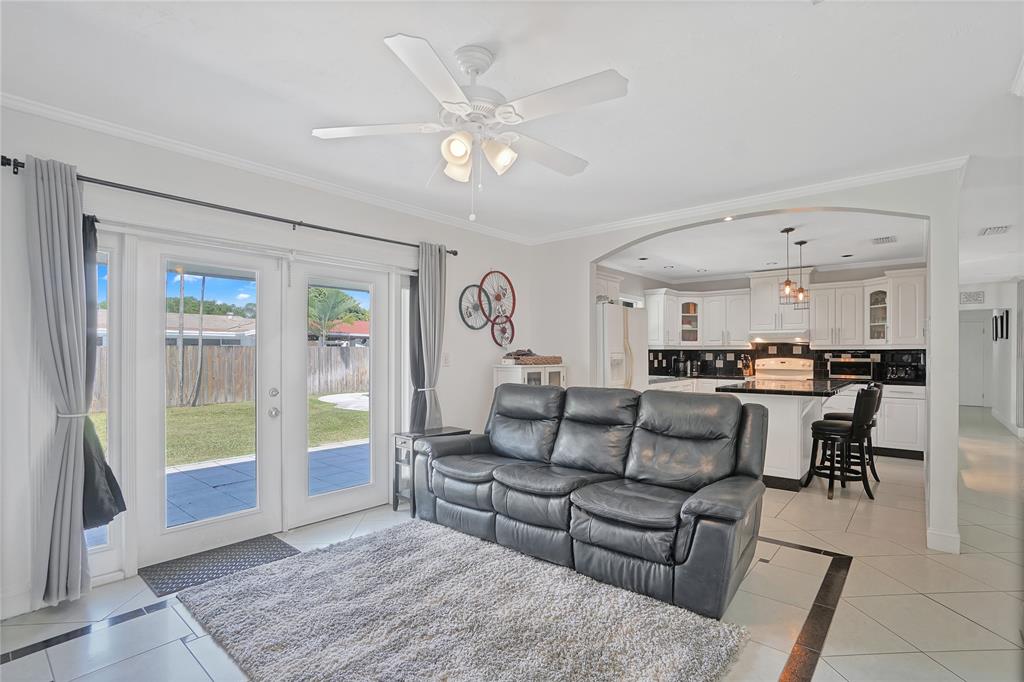 8101 Southwest 198th Street Cutler Bay, FL 33189 - Photo 7 of 16 a living room with furniture and kitchen view