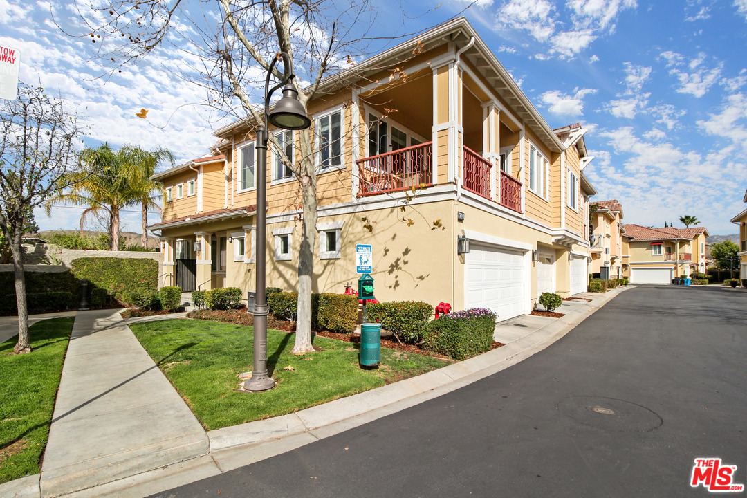 4153 Paredo Way, Unit A Simi Valley, CA 93063 - Photo 1 of 33 a front view of a building with garden