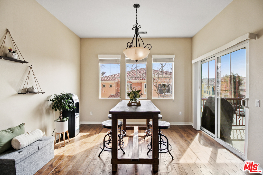 4153 Paredo Way, Unit A Simi Valley, CA 93063 - Photo 12 of 33 a dining room with furniture window and wooden floor
