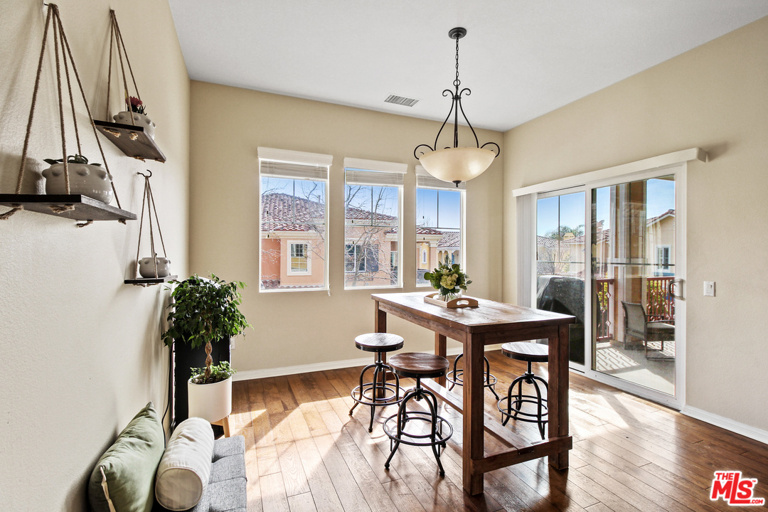 4153 Paredo Way, Unit A Simi Valley, CA 93063 - Photo 13 of 33 a view of a dining room with furniture window and wooden floor