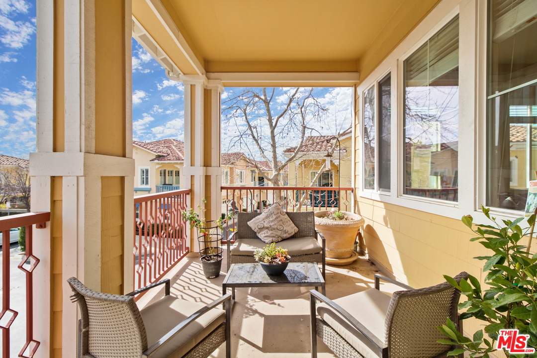 4153 Paredo Way, Unit A Simi Valley, CA 93063 - Photo 14 of 33 a view of a living room with furniture and floor to ceiling windows