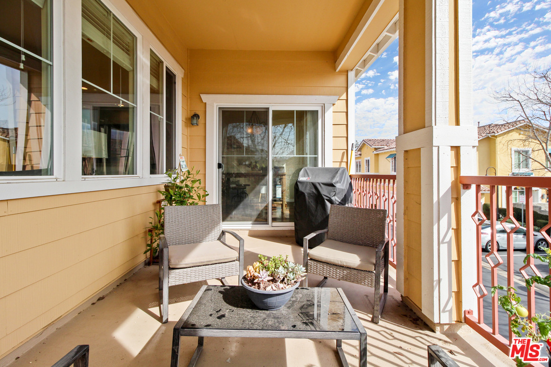 4153 Paredo Way, Unit A Simi Valley, CA 93063 - Photo 15 of 33 a view of a patio with couple of chairs and a potted plant