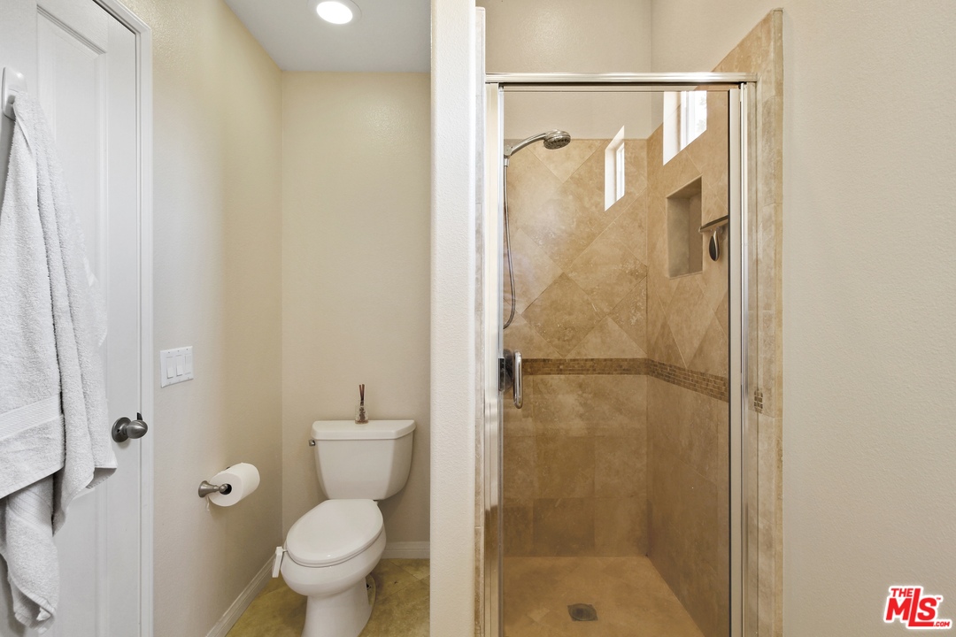 4153 Paredo Way, Unit A Simi Valley, CA 93063 - Photo 21 of 33 a bathroom with a shower and a toilet