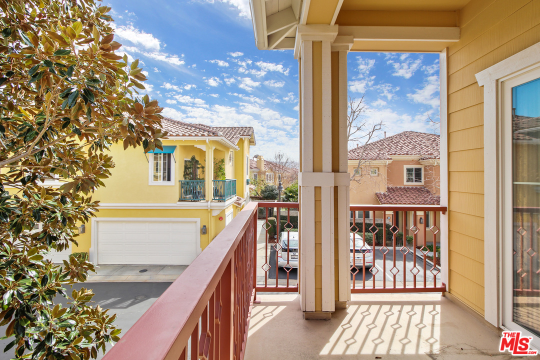 4153 Paredo Way, Unit A Simi Valley, CA 93063 - Photo 23 of 33 a view of a balcony with wooden floor and fence