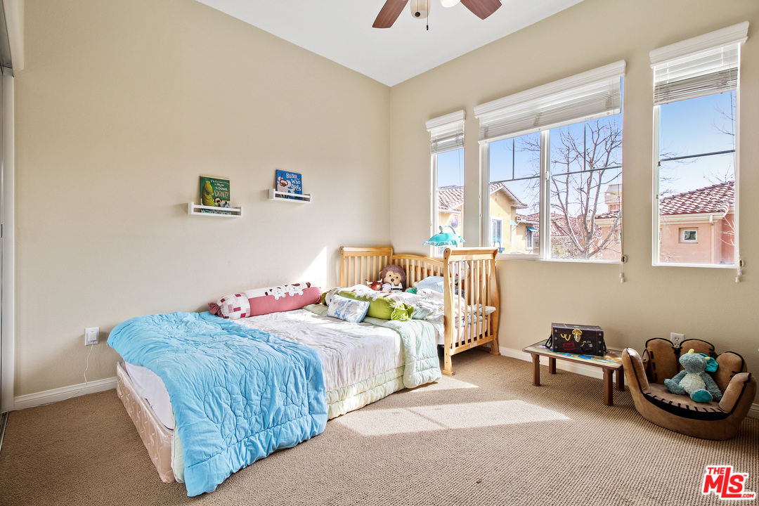 4153 Paredo Way, Unit A Simi Valley, CA 93063 - Photo 24 of 33 a bedroom with two beds and a window