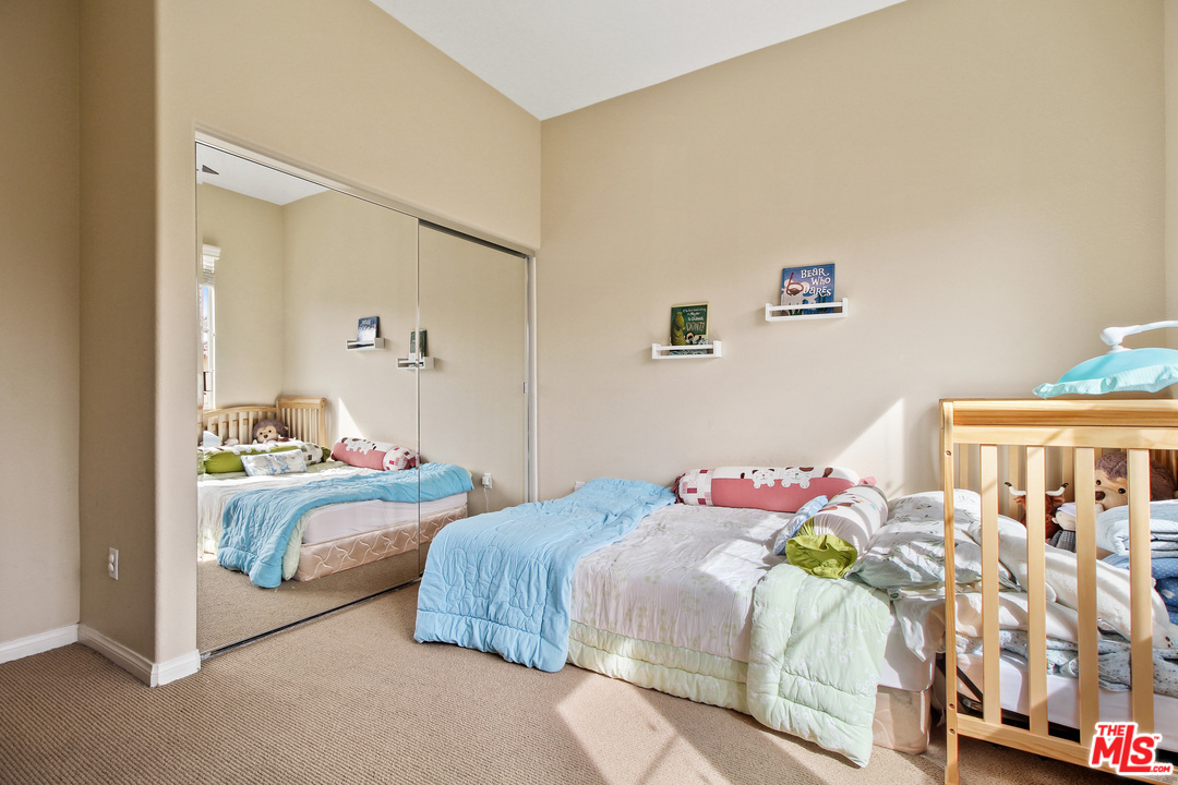 4153 Paredo Way, Unit A Simi Valley, CA 93063 - Photo 25 of 33 a bedroom with bed and a window