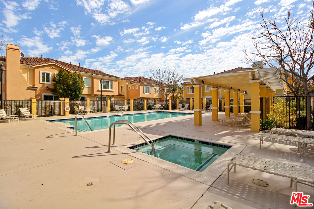 4153 Paredo Way, Unit A Simi Valley, CA 93063 - Photo 31 of 33 a view of a house with a yard