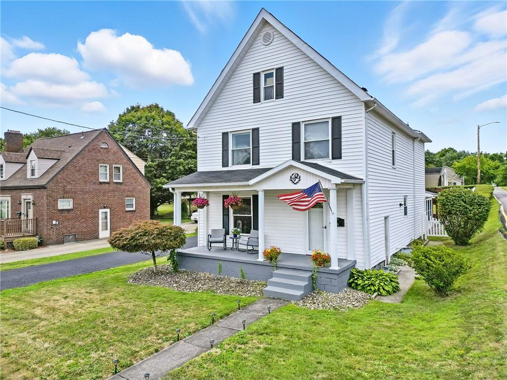 519 West Ridge Avenue Sharpsville, PA 16150 - Photo 1 of 48 a front view of a house with a yard table and chairs