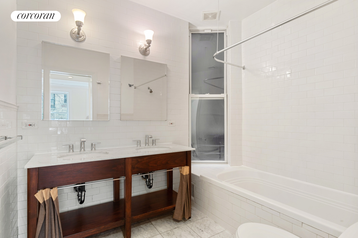 116 East 91st Street Manhattan, NY 10128 - Photo 5 of 11 a bathroom with a tub sink and a mirror