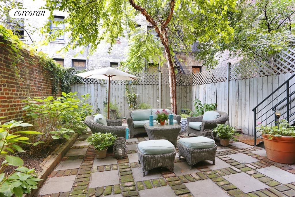 116 East 91st Street Manhattan, NY 10128 - Photo 8 of 11 a view of a patio with couches table and chairs and potted plants