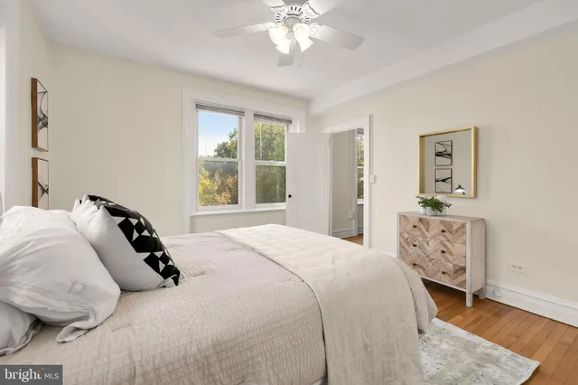 a bedroom with a bed and a dresser