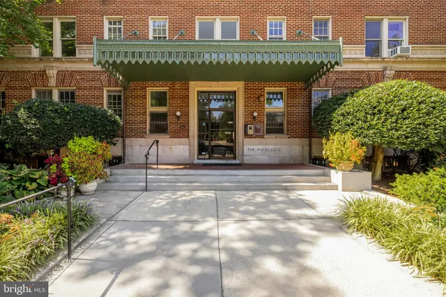 a view of a cafe with sitting area