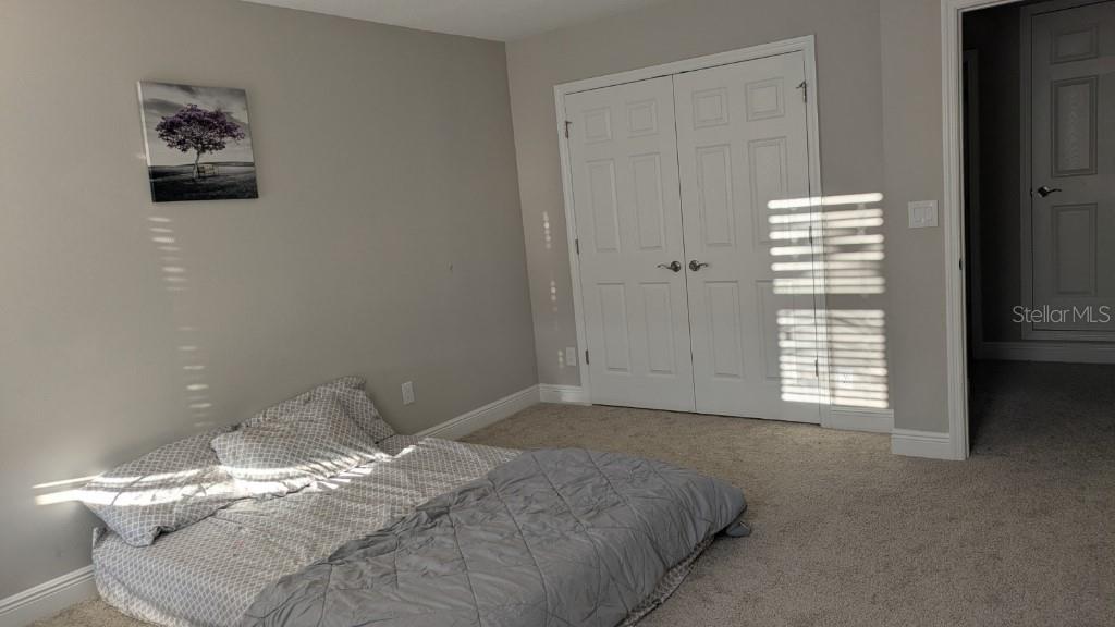 14698 Horse Trot Road Lithia, FL 33547 - Photo 13 of 13 a bedroom with a bed and a window