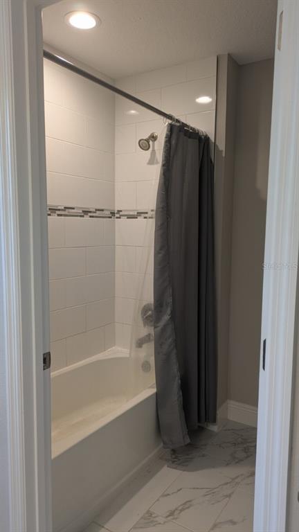 14698 Horse Trot Road Lithia, FL 33547 - Photo 6 of 13 a bathroom with a shower and a bath tub
