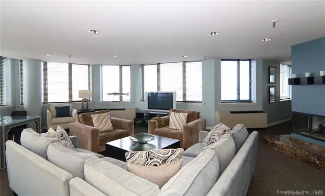 a living room with furniture and a large window