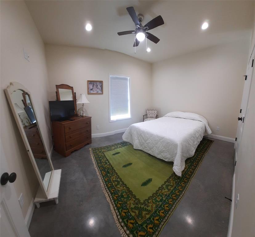 7565 Fm 3116 Anson, TX 79501 - Photo 10 of 15 Spacious room featuring vaulted ceilings, recessed lighting, and a ceiling fan