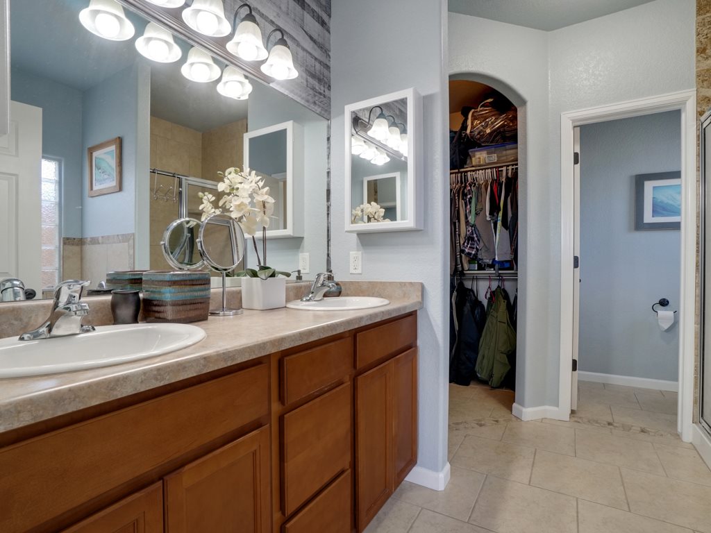 1855 Golden Ranch Road Fruita, CO 81521 - Photo 11 of 24 a en suite bathroom with a sink and a mirror