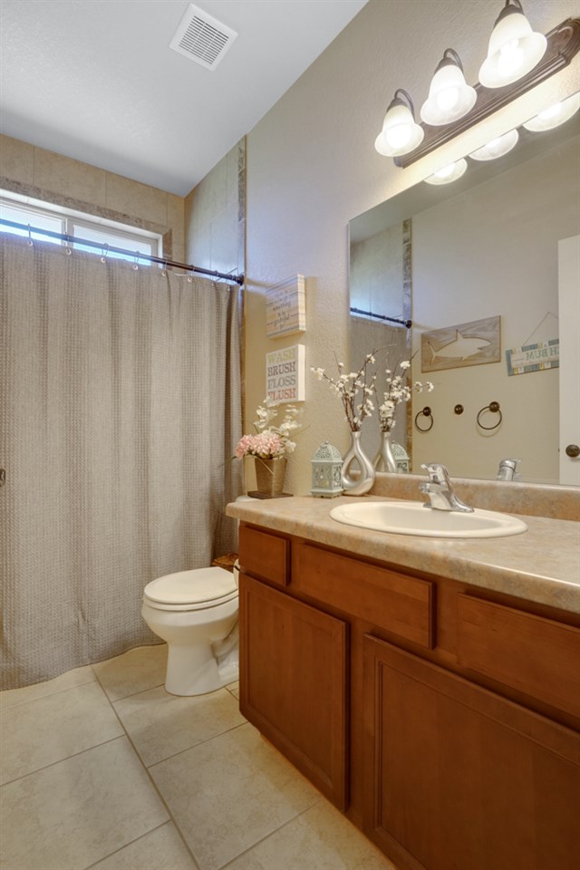 1855 Golden Ranch Road Fruita, CO 81521 - Photo 14 of 24 a bathroom with a toilet a sink and a mirror
