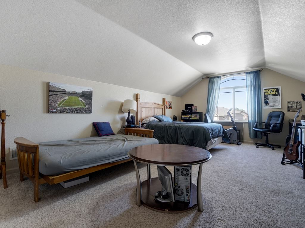 1855 Golden Ranch Road Fruita, CO 81521 - Photo 16 of 24 a bedroom with furniture and a more windows