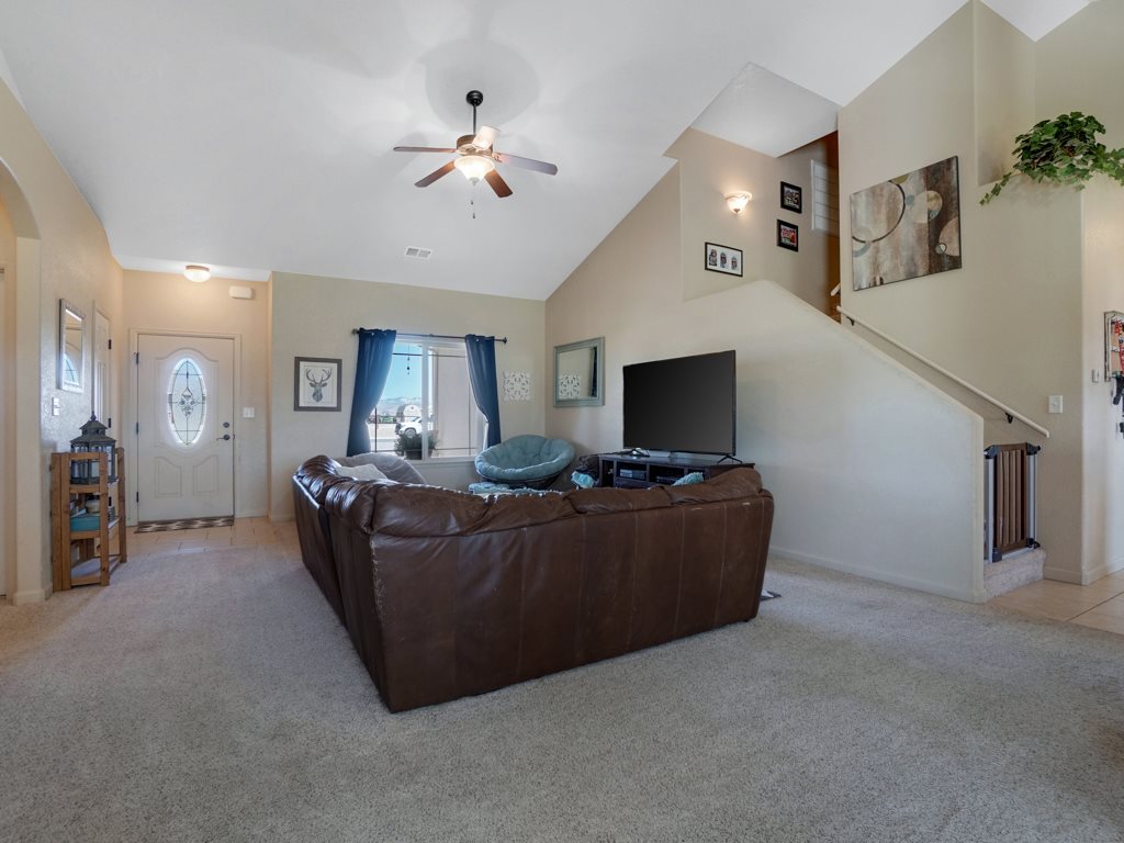 1855 Golden Ranch Road Fruita, CO 81521 - Photo 21 of 24 a living room with furniture and a flat screen tv