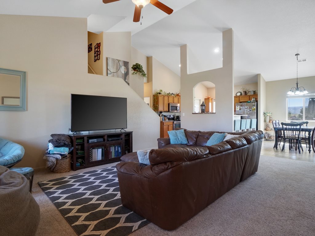 1855 Golden Ranch Road Fruita, CO 81521 - Photo 22 of 24 a living room with furniture and a flat screen tv